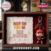 Angus Young Funko Pop keychain inside a wood-framed display box with a paper print featuring Keep the Fire On text and icons.