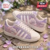 Ariana Grande x Adidas 7 Rings lavender casual shoes with white stripes, moon and star accents, and side bow details.