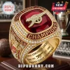 Arsenal FC 2025/26 Premier League Champions Ring featuring a large red stone, gold finish, and encrusted accent diamonds.