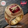 Arsenal FC 2025/26 Premier League Champions Ring featuring a large red center stone, gold plating, and pavé set diamonds.