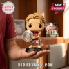 Arsenal FC 2026 FA Community Shield Champions vinyl figure held in hand, featuring a blond player in a red and white kit.