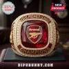 Arsenal FC 2026 Premier League Champions ring with central red stone, Arsenal logo, and encrusted diamond-style accents.