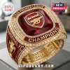 Arsenal FC 2026 Premier League Champions Ring with a red center stone, gold band, and small white embedded diamonds.