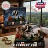 Bell 47 Helicopter 80th Anniversary Building Block Set model on a wooden desk with a pilot minifigure and forest scene.