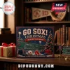 Boston Red Sox Christmas Ornament Advent Calendar box featuring Fenway Park imagery on a wooden desk with baseball items.