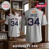 Boston Red Sox David Ortiz 34 football jersey in light grey with navy blue and red accents on wooden mannequin displays.