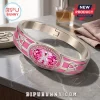Breast Cancer Awareness Pink Crystal Bracelet featuring a center pink stone, silver wings, and HOPE STRENGTH LOVE text.