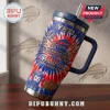 Buffalo Bills 1960-2026 Anniversary Edition Stanley Tumbler with red and blue tie-dye pattern and steel straw.