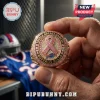 Buffalo Bills Breast Cancer Awareness Ring featuring a pink ribbon, diamond accents, and team branding held by hand.