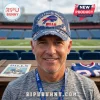 Buffalo Bills Est 1960 Patch Distressed Baseball Cap in blue with frayed edges worn by a man at a football stadium.