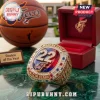 Caitlin Clark Indiana Fever 22 Gold Championship Ring featuring a red stone, encrusted diamonds, and team branding.