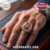 Caitlin Clark Indiana Fever 22 Gold Championship Ring worn on a finger, featuring a red and blue face with diamond accents.
