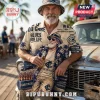 Carlton Blues AFL Mascot Hawaiian shirt in beige featuring palm trees, team logos, and text against a classic car background.