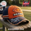Chicago Bears 1919-2026 Anniversary Distressed Cap in navy and orange featuring team embroidery on a wooden bench.