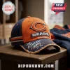 Chicago Bears 1919-2026 Anniversary Distressed Cap with navy and orange panels and frayed brim sitting on wooden surface.