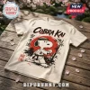 Cobra Kai Strike First Strike Hard cream T-shirt featuring a cartoon dog in a karate gi with a red sun background.
