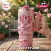 Custom Breast Cancer Awareness Rhinestone Stanley Tumbler in glittery pink featuring a heart ribbon, bow, and custom text.