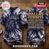 Dallas Cowboys America's Team tie-dye shirt featuring a blue and white spiral pattern with team logos and text on wood.