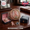 Dallas Cowboys Breast Cancer Awareness Ring featuring a pink ribbon, clear crystals, and a blue star on a wooden table.