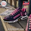 Dallas Cowboys x Breast Cancer Awareness Air Max Plus Sneakers in navy blue and pink with a white sole on a wooden bench.