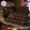 Days Of Krampus Christmas Advent Calendar featuring 24 miniature devil figures displayed on a tiered wooden shelf.