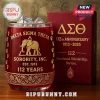 Delta Sigma Theta 112th Anniversary drinking glass with gold elephant logo and red glass finish next to a matching box.