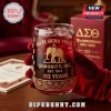 Delta Sigma Theta 112th Anniversary Drinking Glass with gold elephant logo and Sorority Inc text in a gloved hand.