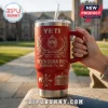 Delta Sigma Theta 113th Anniversary Red 40oz tumbler with gold laser-etched sorority crest and symbols held in hand.