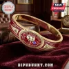 Delta Sigma Theta Elephant Hinge Bracelet featuring a gold band with red enamel, an elephant emblem, and 1913 markings.