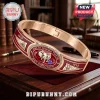Delta Sigma Theta Elephant Hinge Bracelet in gold tone with crimson enamel, featuring 1913 year marking and elephant icon.
