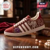 Delta Sigma Theta Maroon Elephant Pattern Casual Shoes featuring a purple floral design and Greek letters on a wood table.