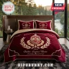 Delta Sigma Theta Maroon Quilted 3-Piece Bedding Set featuring gold embroidery, sorority crest, and monogrammed pillows.
