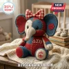 Delta Sigma Theta Patchwork Elephant Plush Toy featuring red and blue fabric, a plaid bow, and Greek letter embroidery.