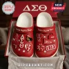 Delta Sigma Theta Red Crocs With Charms featuring branded symbols, greek letters, and 1913 text in a display box.