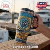 Detroit Lions 1930-2026 Stanley Tumbler 40oz with a roaring lion graphic, ocean waves, and beach imagery on a metal cup.