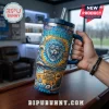 Detroit Lions 1930-2026 Stanley Tumbler 40oz featuring a roaring lion mascot, beach graphics, and blue and gold color scheme.