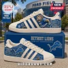 Detroit Lions Motor City Casual Sneakers featuring blue lion graphics, Detroit skyline art, and white leather accents.