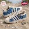 Detroit Lions Motor City Casual Sneakers featuring blue and white team graphics on a sand background.