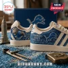 Detroit Lions Motor City Casual Sneakers featuring cream uppers with blue graphic detailing, lion logos, and text accents.