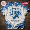 Detroit Lions NFL Bleached Tie-Dye T-Shirt featuring blue and white splatter patterns with team branding on wood background.