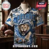 Detroit Lions NFL Mascot Hawaiian Shirt featuring a roaring lion, blue team colors, and palm tree tropical patterns.