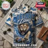 Detroit Lions NFL Mascot Hawaiian Shirt with lion graphic, blue football helmet, palms, and city skyline on cream fabric.