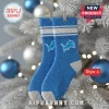 Detroit Lions Team acrylic Christmas ornament style socks in blue and silver hanging on a white holiday tree.