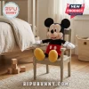 Disney Mickey Mouse Soft Plush Toy with black ears, red shorts, and yellow shoes sitting on a small wooden nursery chair.