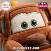 Disney Pixar Cars Tow Mater plush pillow featuring a brown fabric exterior, embroidered white eyes, and green pupils.
