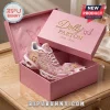 Dolly Parton In Loving Memory 1946-2026 Air Max Plus sneakers with pink floral motifs inside a matching commemorative box.