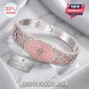 Dolly Parton Love Is Like A Butterfly Bracelet in silver tone with pink enamel, crystal accents, and guitar motifs.