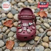 Dr Pepper Maroon Clogs with Charms featuring soda bottle, cherry, and ice cube icons on a rocky outdoor background.