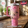 Elvis Presley 90th Birthday Pink Stanley Tumbler featuring black dandelion prints and TCB lightning bolt logos on a desk.