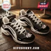 Elvis Presley Black And White TN Sneakers featuring a portrait of Elvis, white laces, and a patterned black mesh design.